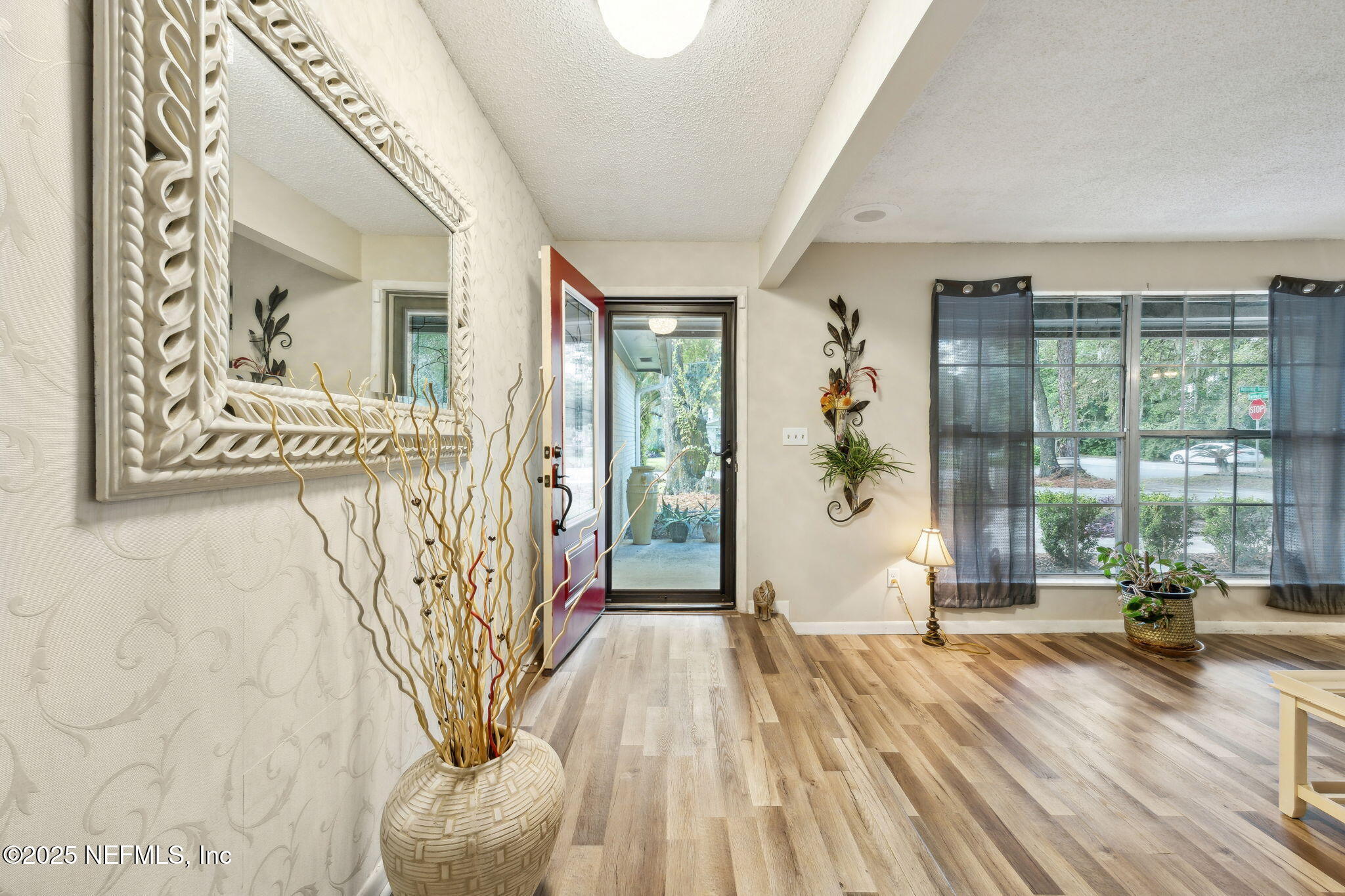 6305 Wuthering Heights Road Jacksonville, FL 32211 - Photo 3 of 52 a view of entryway with wooden floor