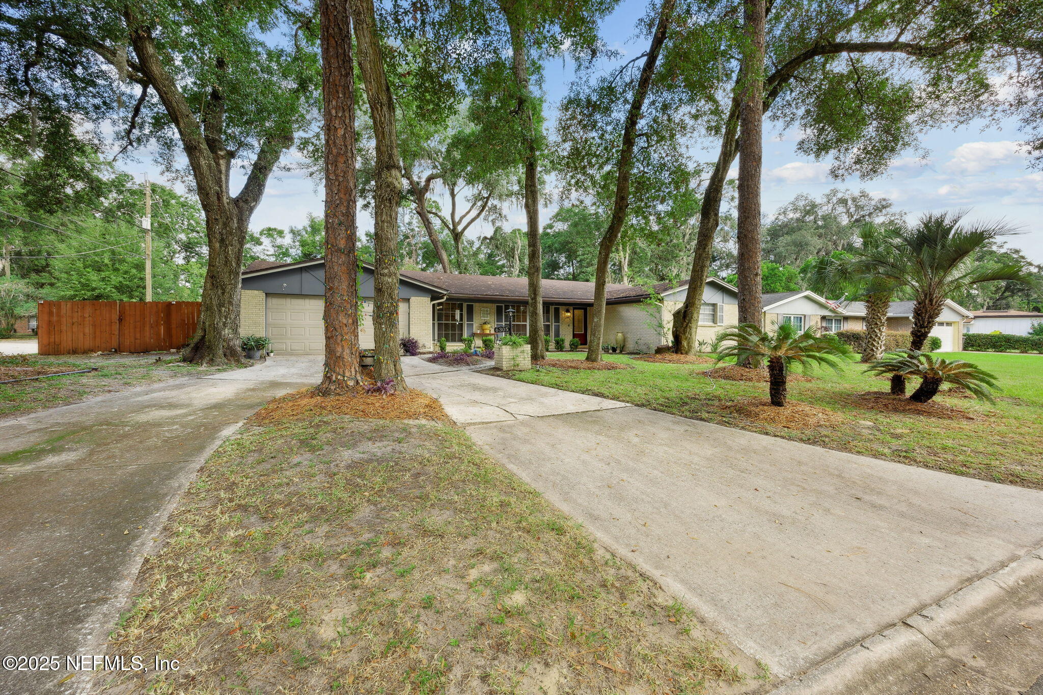 6305 Wuthering Heights Road Jacksonville, FL 32211 - Photo 33 of 52 front view of a house with a trees