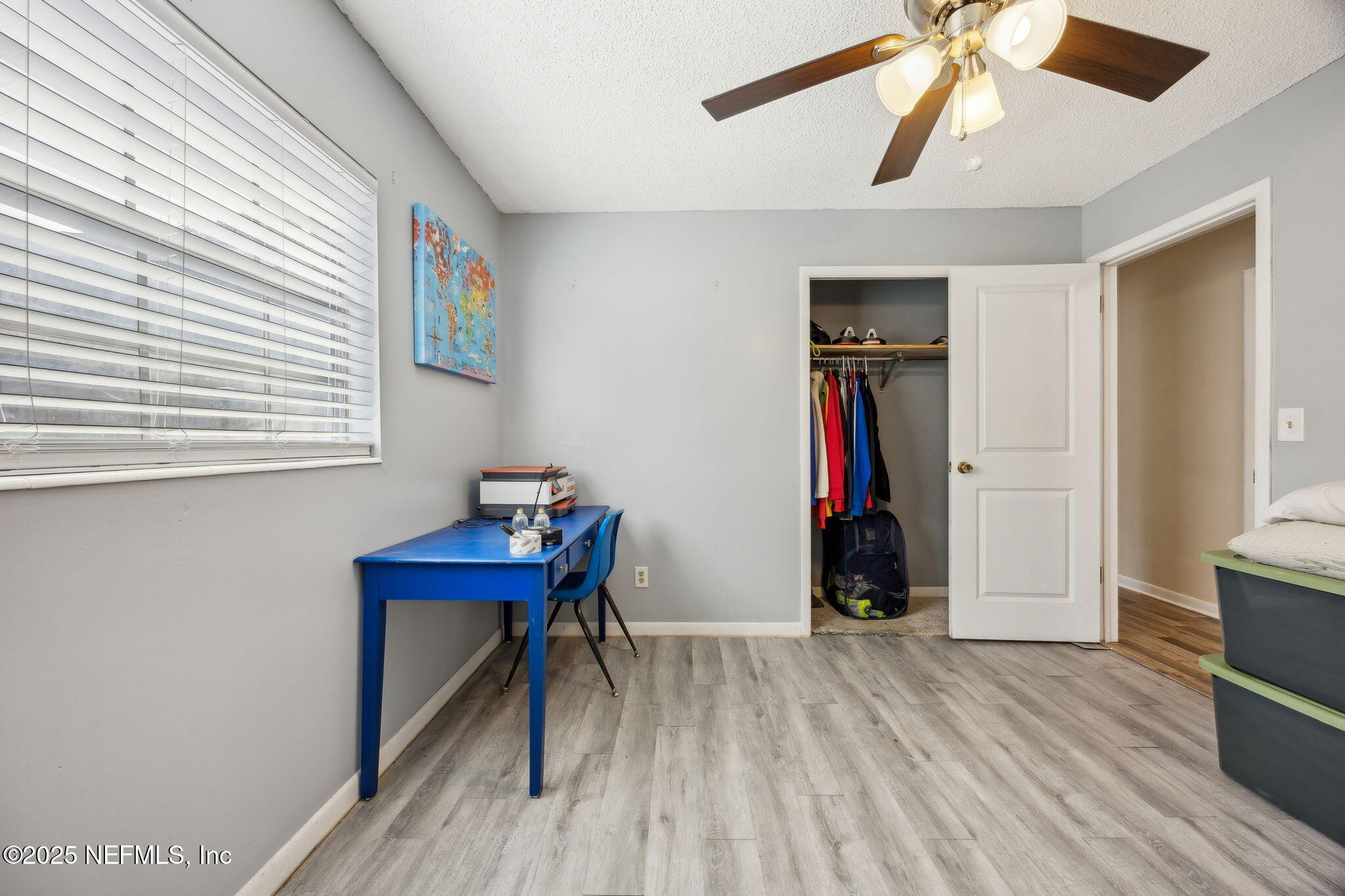 6305 Wuthering Heights Road Jacksonville, FL 32211 - Photo 43 of 52 a room that has a bed and a bookshelf