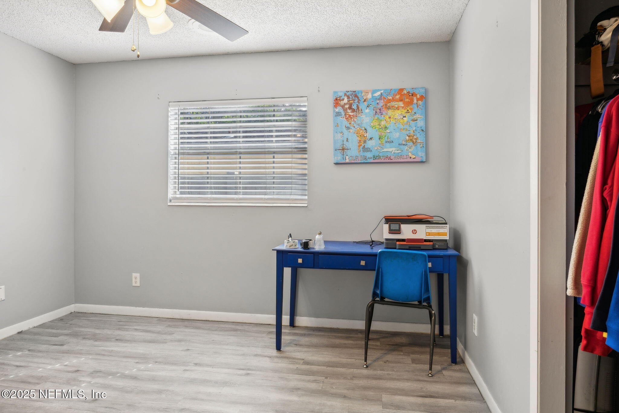 6305 Wuthering Heights Road Jacksonville, FL 32211 - Photo 43 of 53 a workspace with furniture and a book shelf