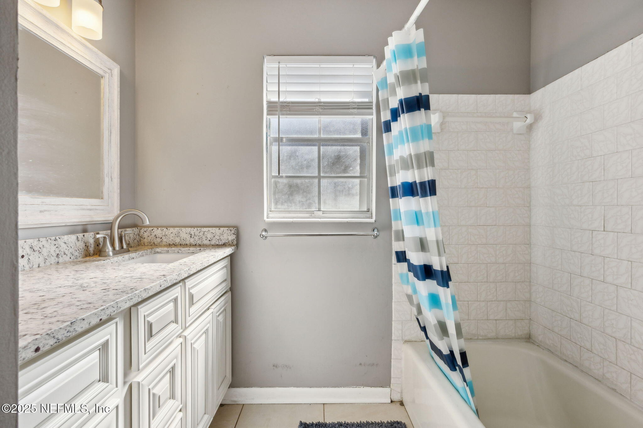 6305 Wuthering Heights Road Jacksonville, FL 32211 - Photo 45 of 53 a bathroom with a granite countertop sink a toilet and shower