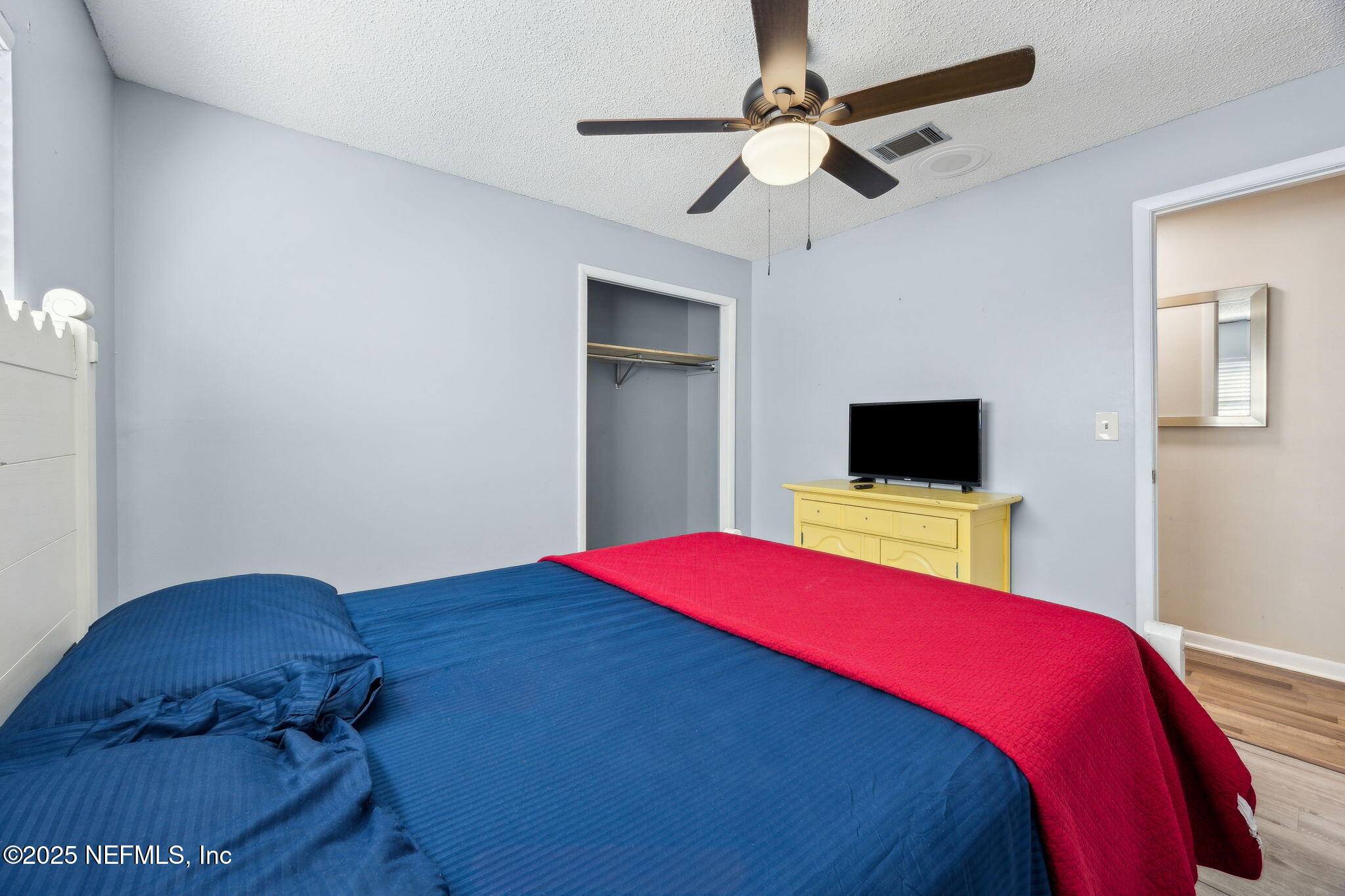6305 Wuthering Heights Road Jacksonville, FL 32211 - Photo 46 of 52 a bedroom with a bed and a tv