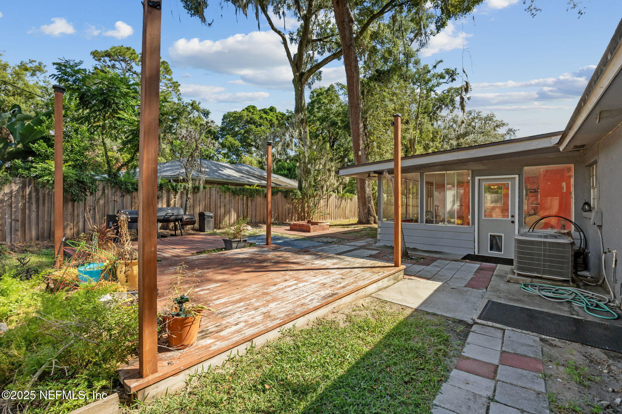 6305 Wuthering Heights Road Jacksonville, FL 32211 - Photo 50 of 52 a view of a house with backyard and garden