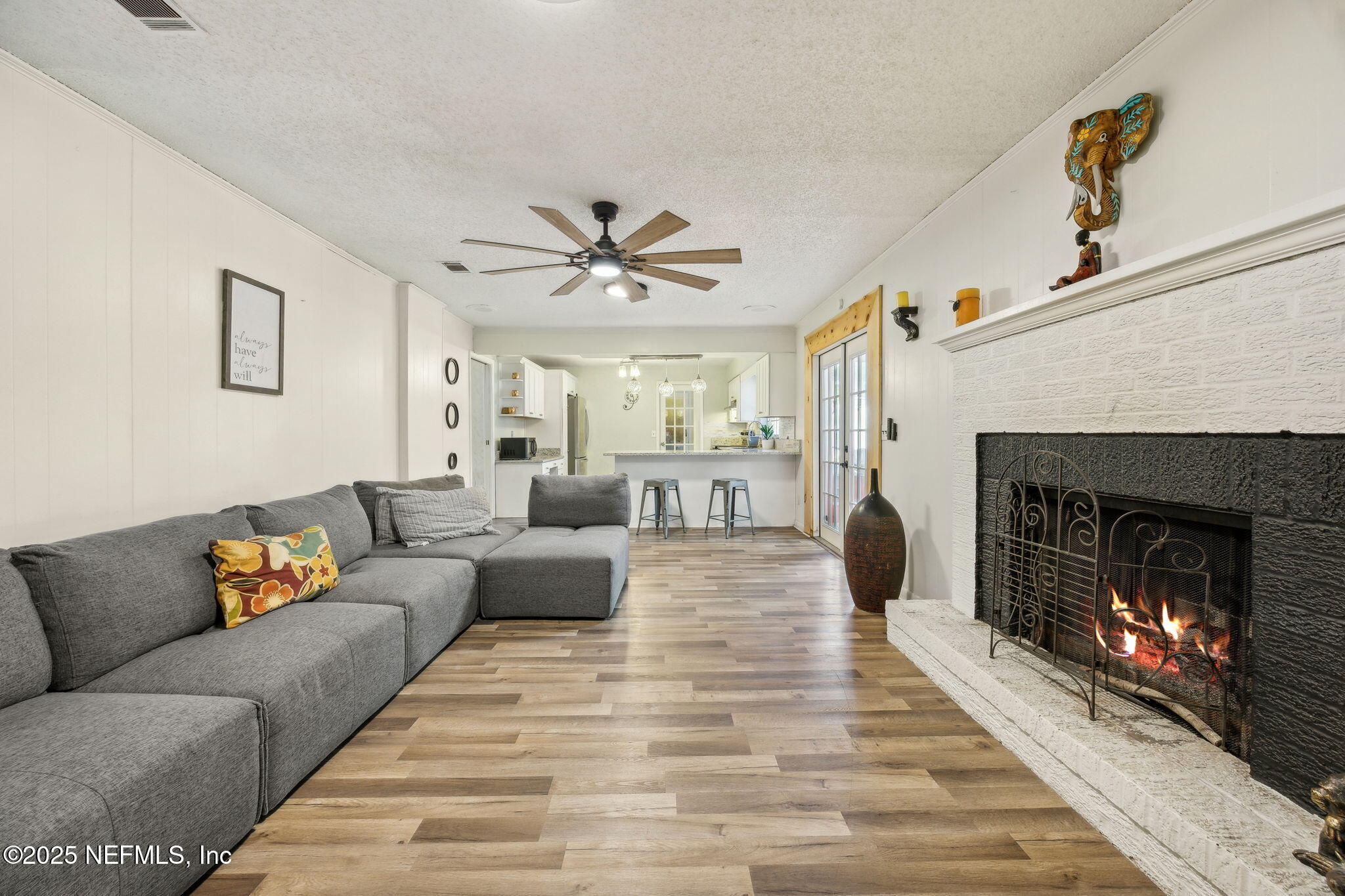 6305 Wuthering Heights Road Jacksonville, FL 32211 - Photo 5 of 52 a living room with furniture and a fireplace
