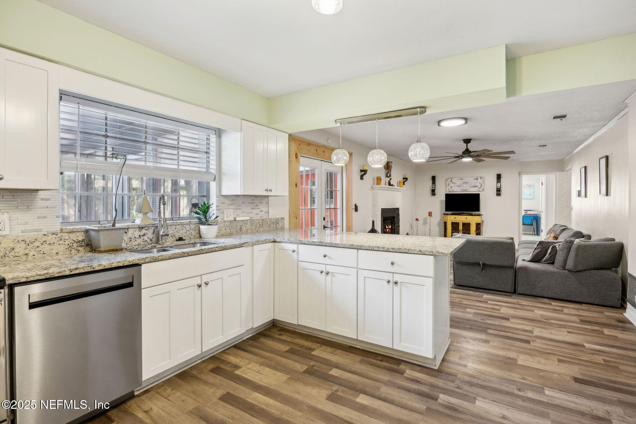 6305 Wuthering Heights Road Jacksonville, FL 32211 - Photo 6 of 52 a spacious bathroom with a granite countertop sink mirror and a