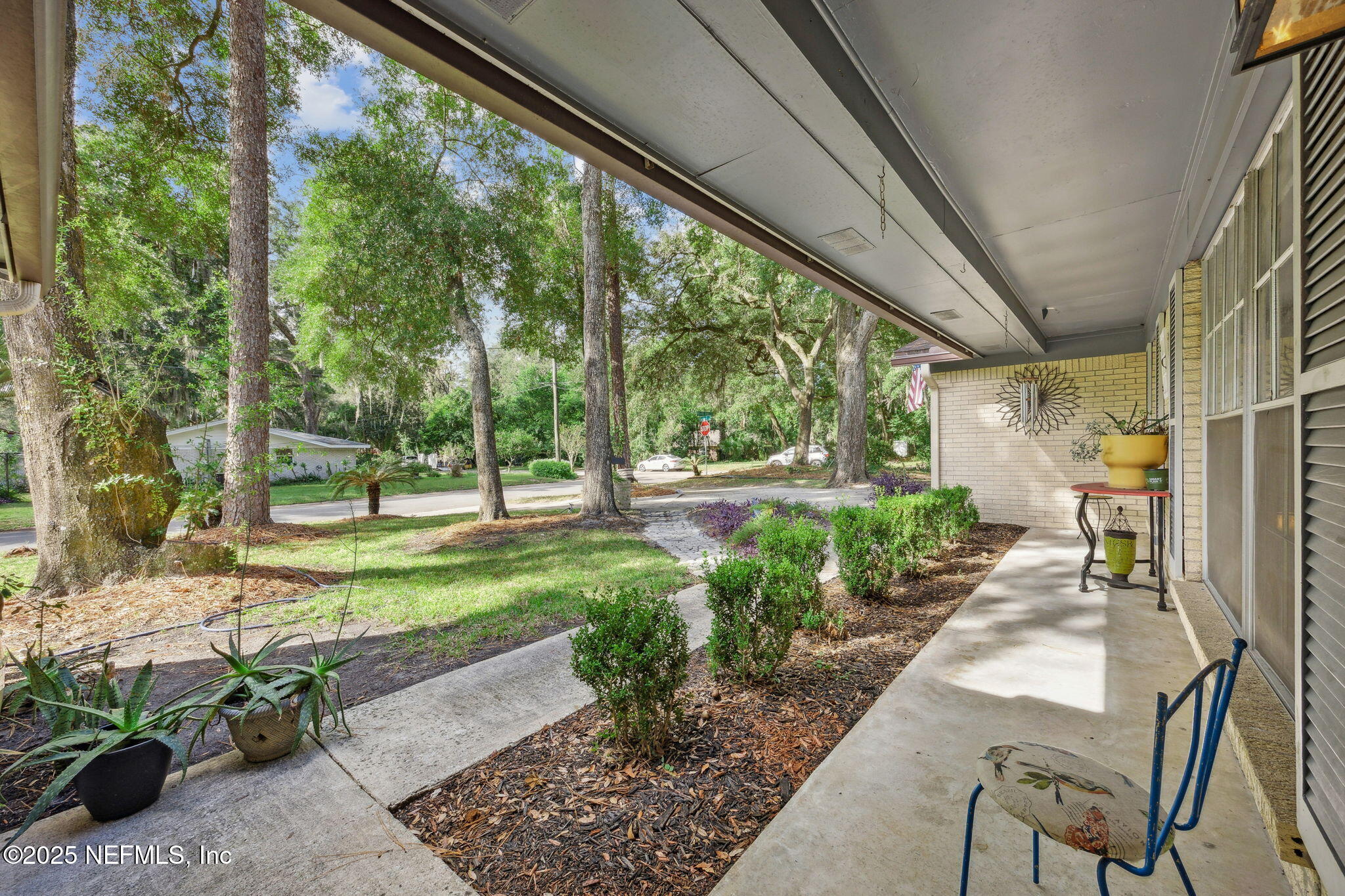 6305 Wuthering Heights Road Jacksonville, FL 32211 - Photo 8 of 52 a view of a porch with furniture and garden