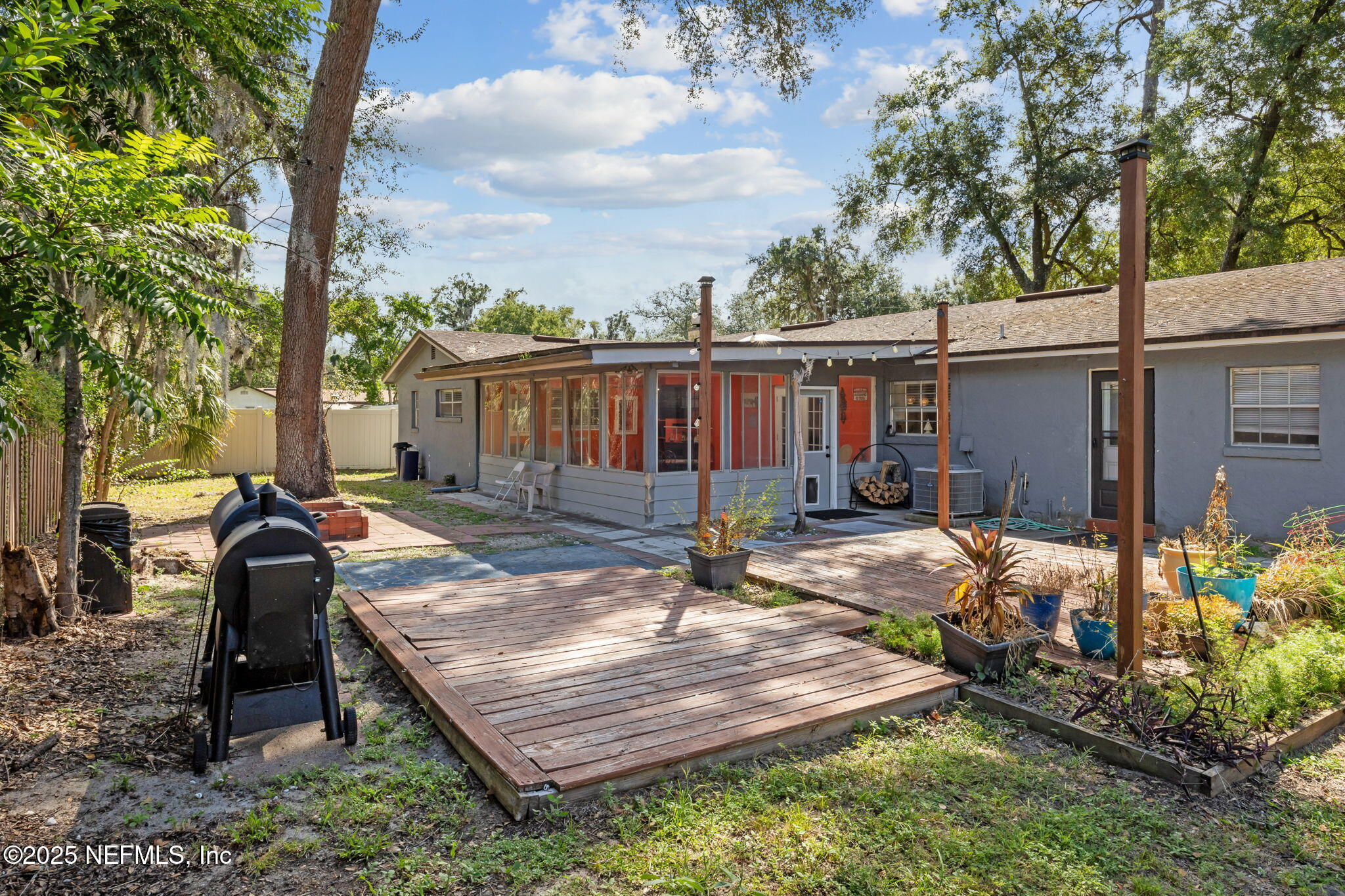 6305 Wuthering Heights Road Jacksonville, FL 32211 - Photo 9 of 52 a view of a backyard with sitting area