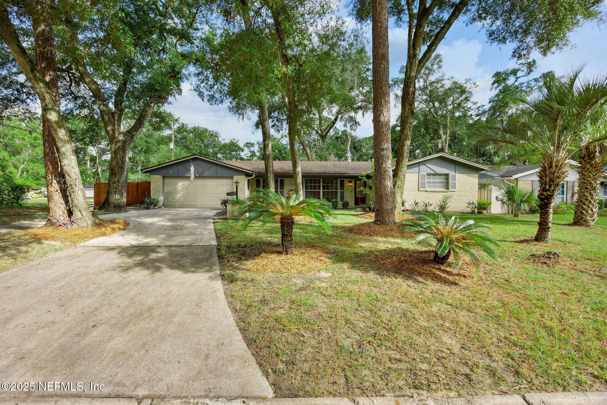 6305 Wuthering Heights Road Jacksonville, FL 32211 - Photo 10 of 53 a view of a house with backyard and a tree