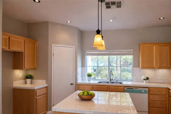 a kitchen with a sink and a window