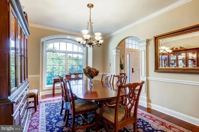 a kitchen with stainless steel appliances granite countertop wooden floor stove top oven with granite countertops and cabinets
