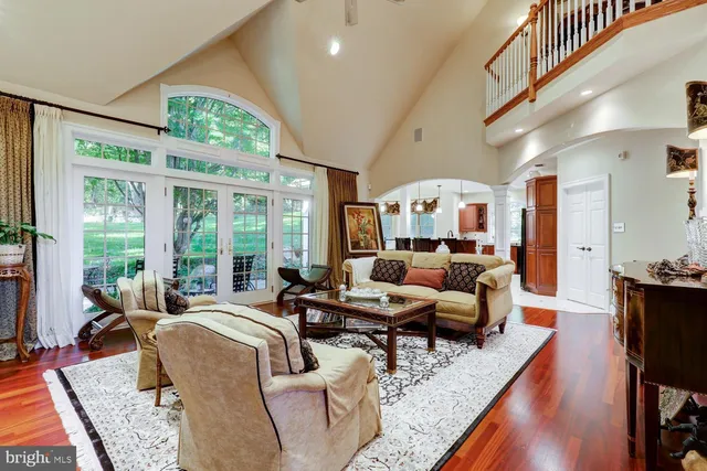 a living room with a large bed and a large window