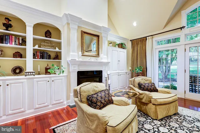 a white bath tub sitting in a bathroom next to a window