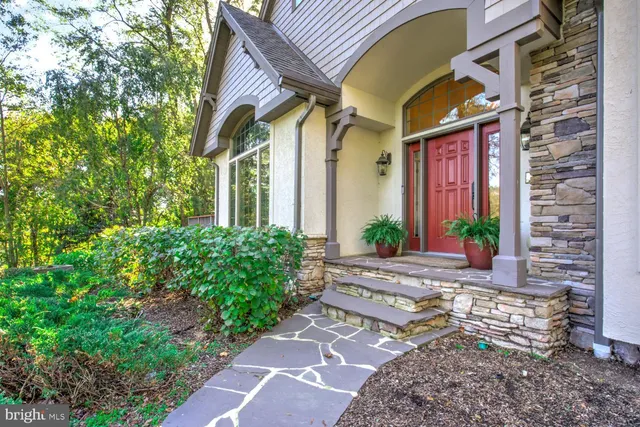 a view of a livingroom with wooden floor and a rug