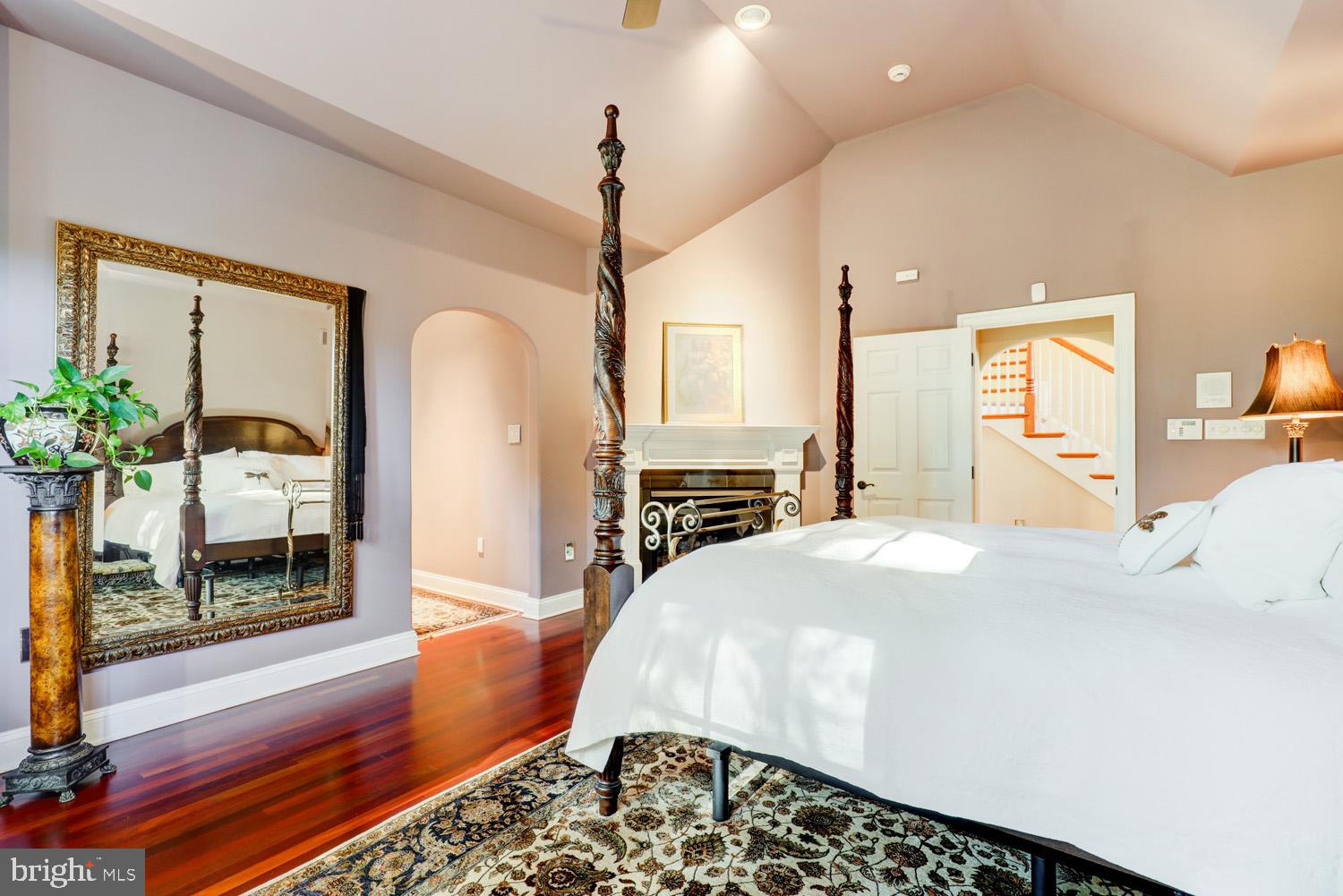 2326 Conestoga Road Chester Springs, PA 19425 - Photo 31 of 85 a bedroom with a bed a potted plant on dresser and a wooden floor
