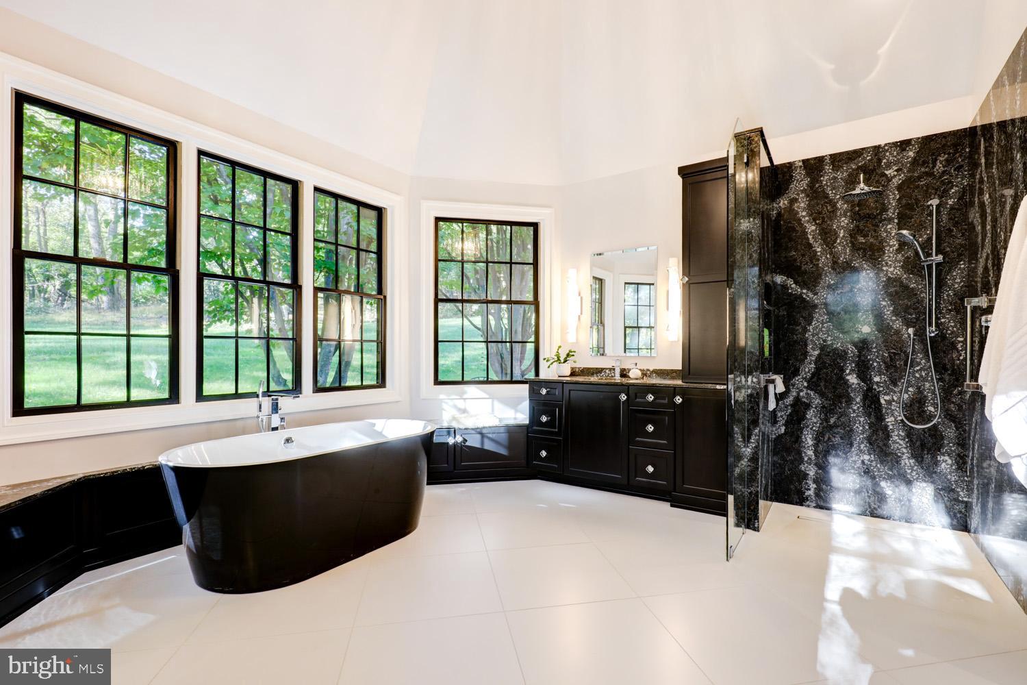 2326 Conestoga Road Chester Springs, PA 19425 - Photo 36 of 85 a living room with a large bed and a large window