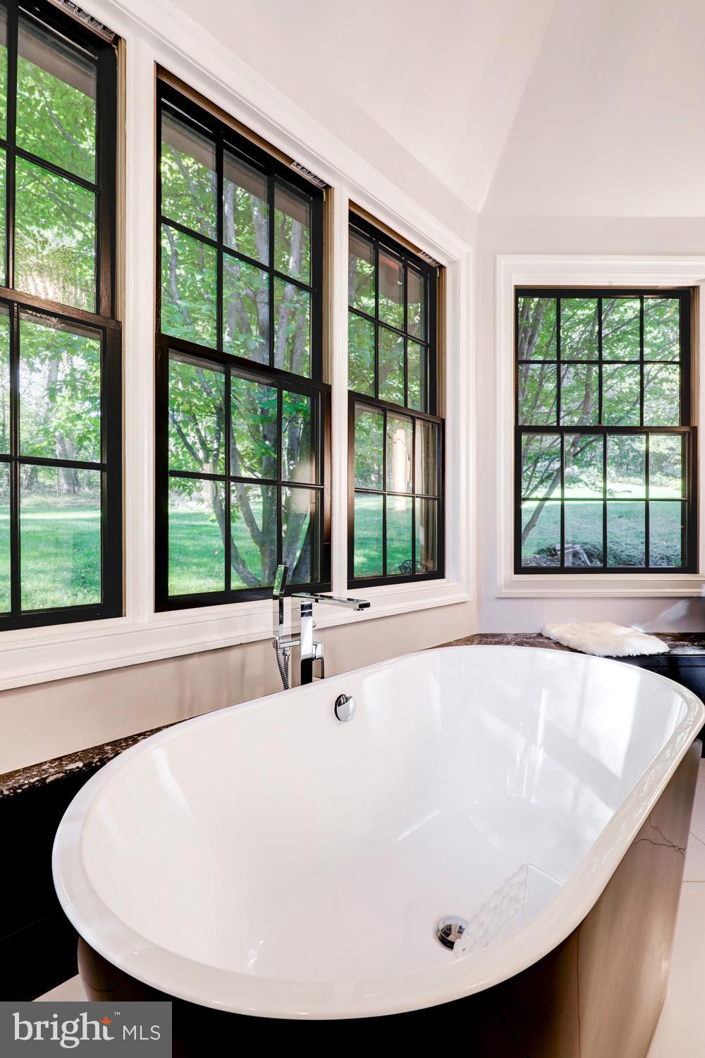 2326 Conestoga Road Chester Springs, PA 19425 - Photo 38 of 85 a white bath tub sitting in a bathroom next to a window