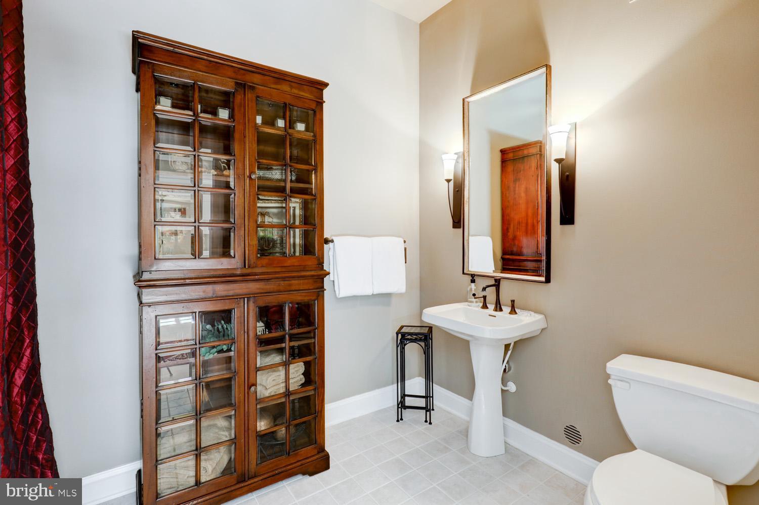 2326 Conestoga Road Chester Springs, PA 19425 - Photo 60 of 85 a bathroom with a sink a toilet and a mirror
