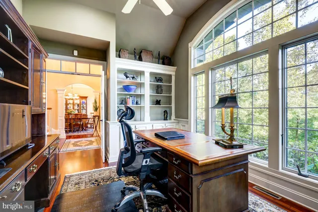 a view of entryway dining room and hall with wooden floor