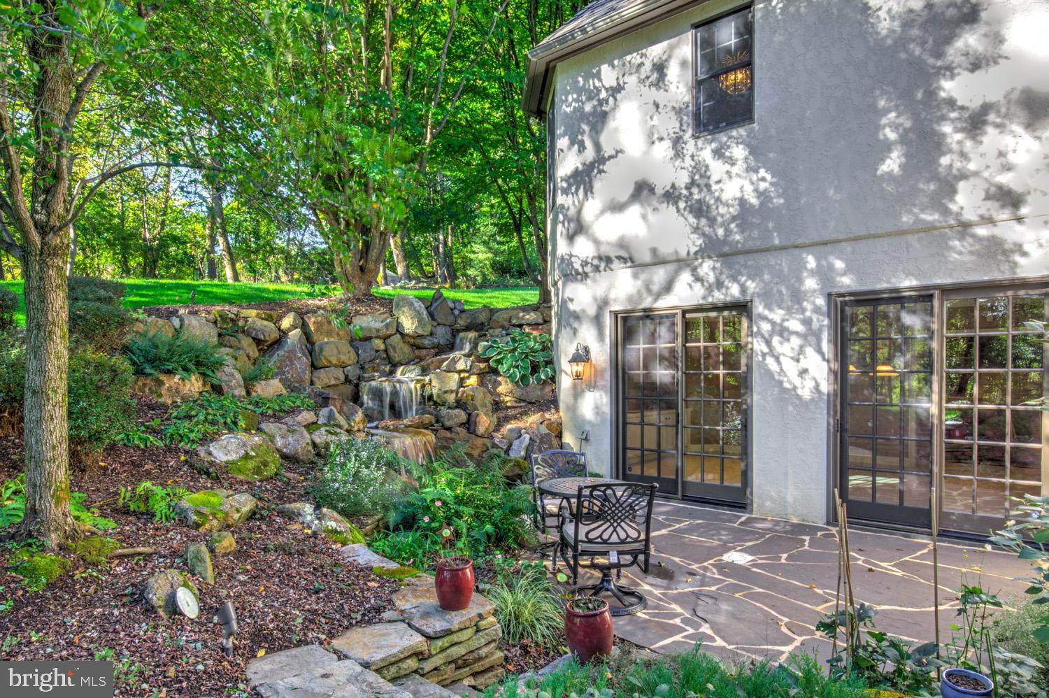 2326 Conestoga Road Chester Springs, PA 19425 - Photo 79 of 85 a view of a patio with table and chairs and potted plants