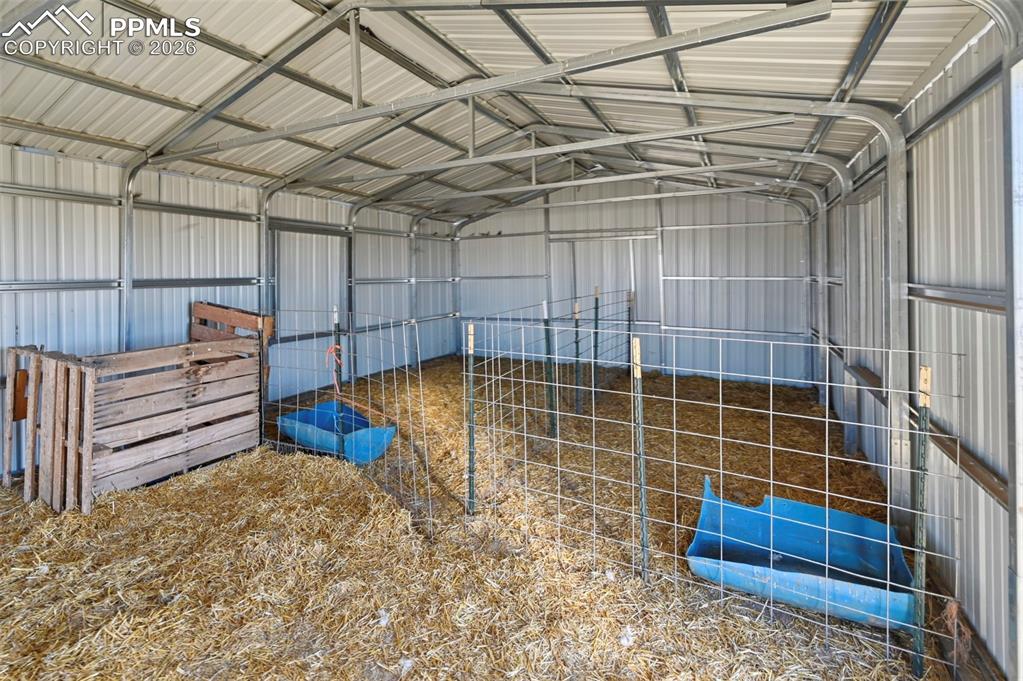 9800 Boone Road Yoder, CO 80864 - Photo 10 of 31 a view of a room with racks on the wall