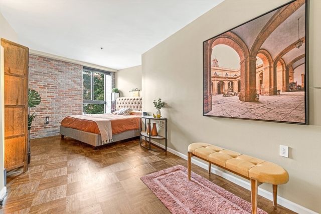 a bedroom with a bed and a couch