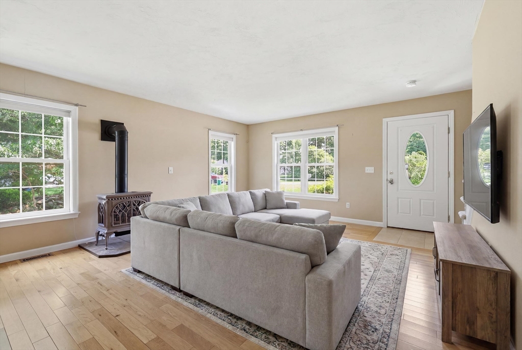 9 Rock Marsh Road, Unit B Wareham, MA 02571 - Photo 11 of 41 a living room with furniture and a flat screen tv