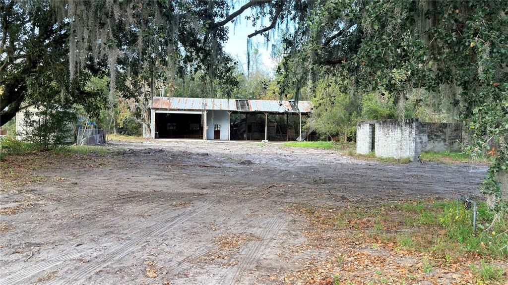 11 7th Street Southeast Fort Meade, FL 33841 - Photo 12 of 19 a front view of a house with a yard and trees