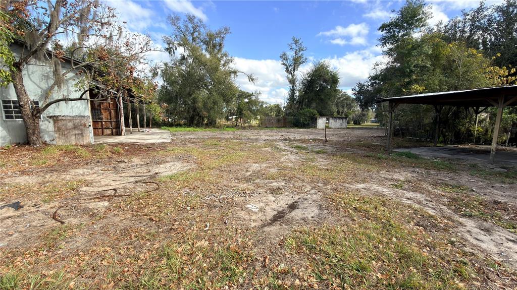 11 7th Street Southeast Fort Meade, FL 33841 - Photo 15 of 19 a view of a yard with wooden fence