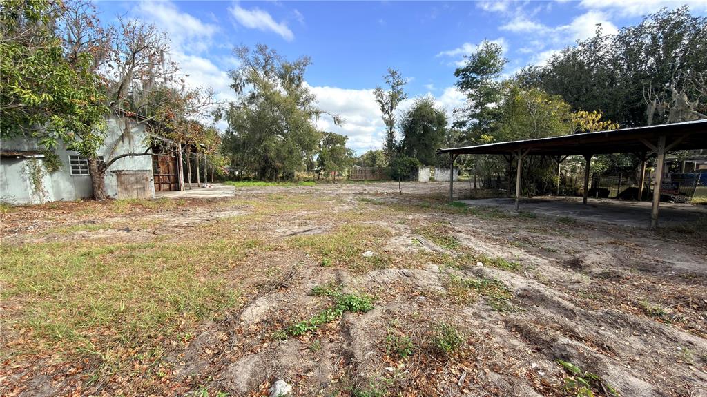 11 7th Street Southeast Fort Meade, FL 33841 - Photo 16 of 19 a view of a yard with wooden fence