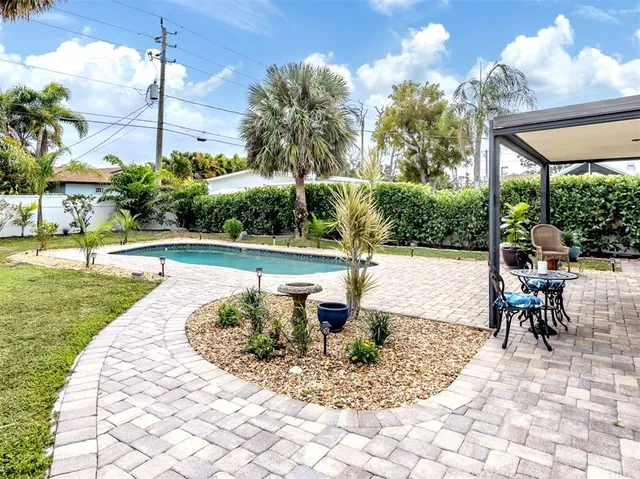 a view of a swimming pool with a patio