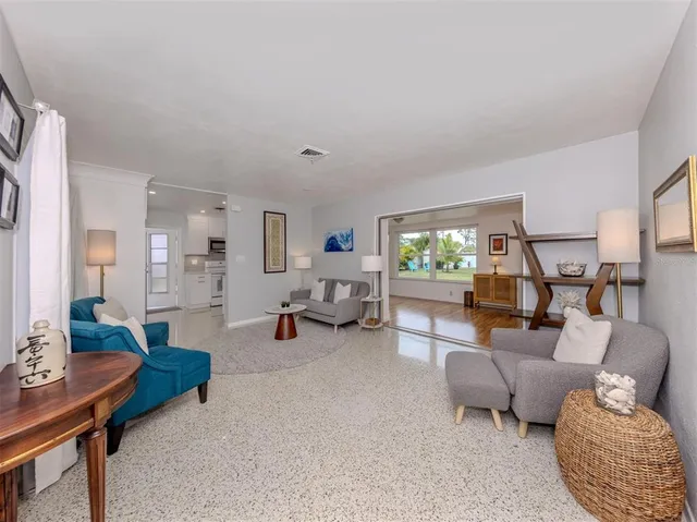 a living room with furniture and a table