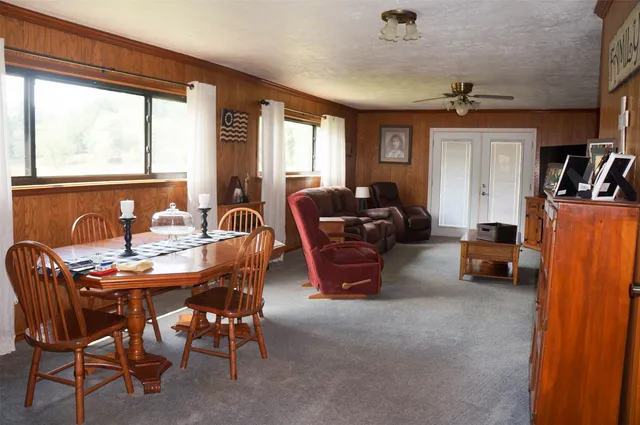 a dining room with furniture and window