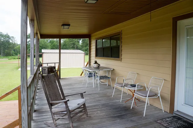 a patio with table and chairs