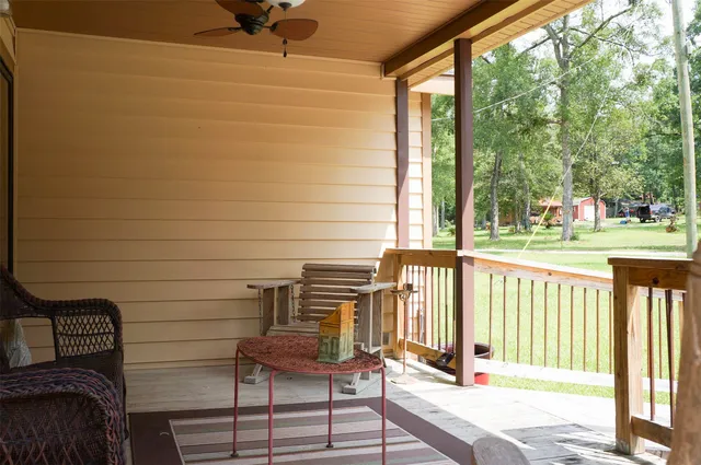 a view of a two chairs in the balcony