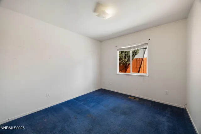 an empty room with window