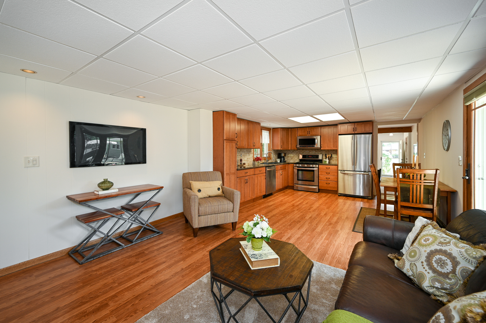 440 West Harrison Road Lombard, IL 60148 - Photo 12 of 26 a living room with furniture kitchen view and a wooden floor