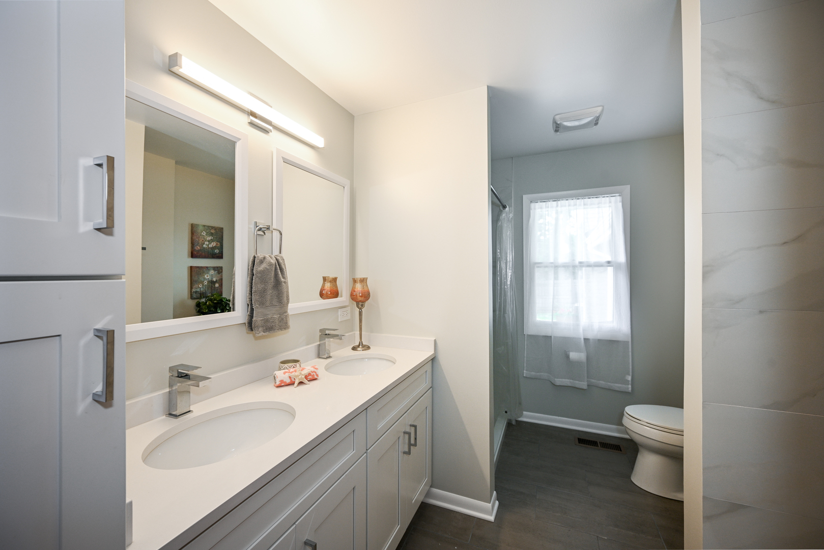 440 West Harrison Road Lombard, IL 60148 - Photo 20 of 26 a bathroom with a double vanity sink toilet and shower