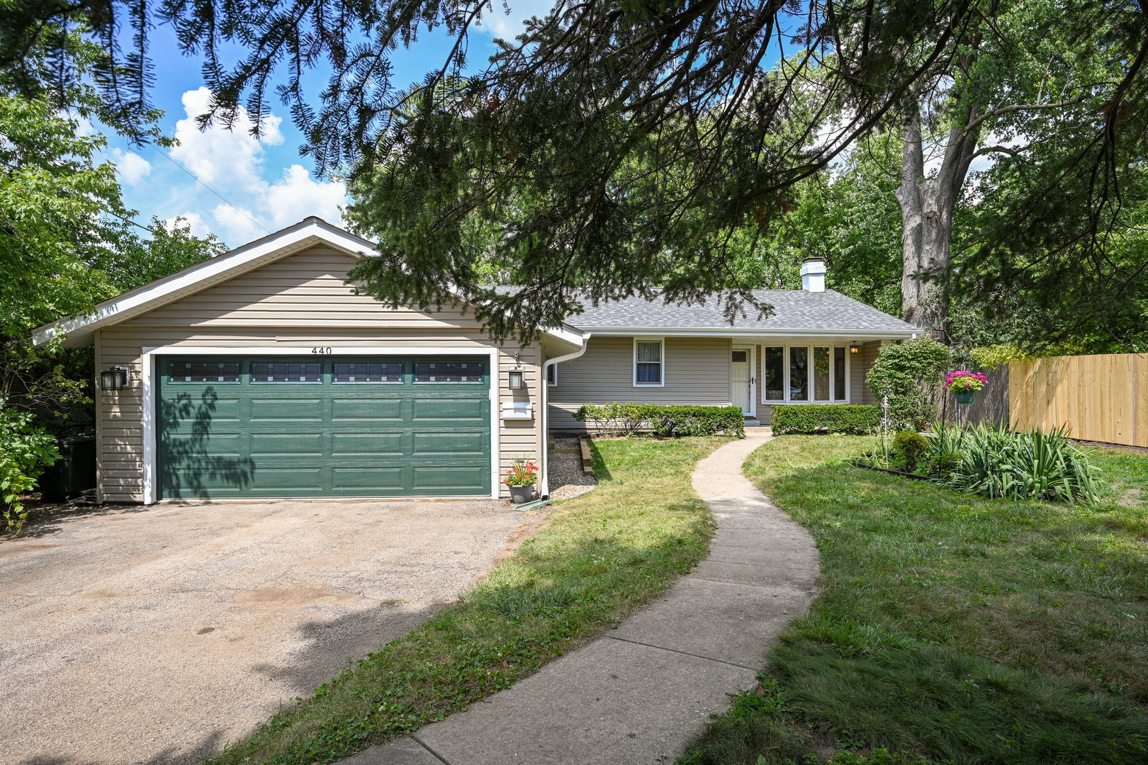 440 West Harrison Road Lombard, IL 60148 - Photo 2 of 26 a front view of a house with yard and green space