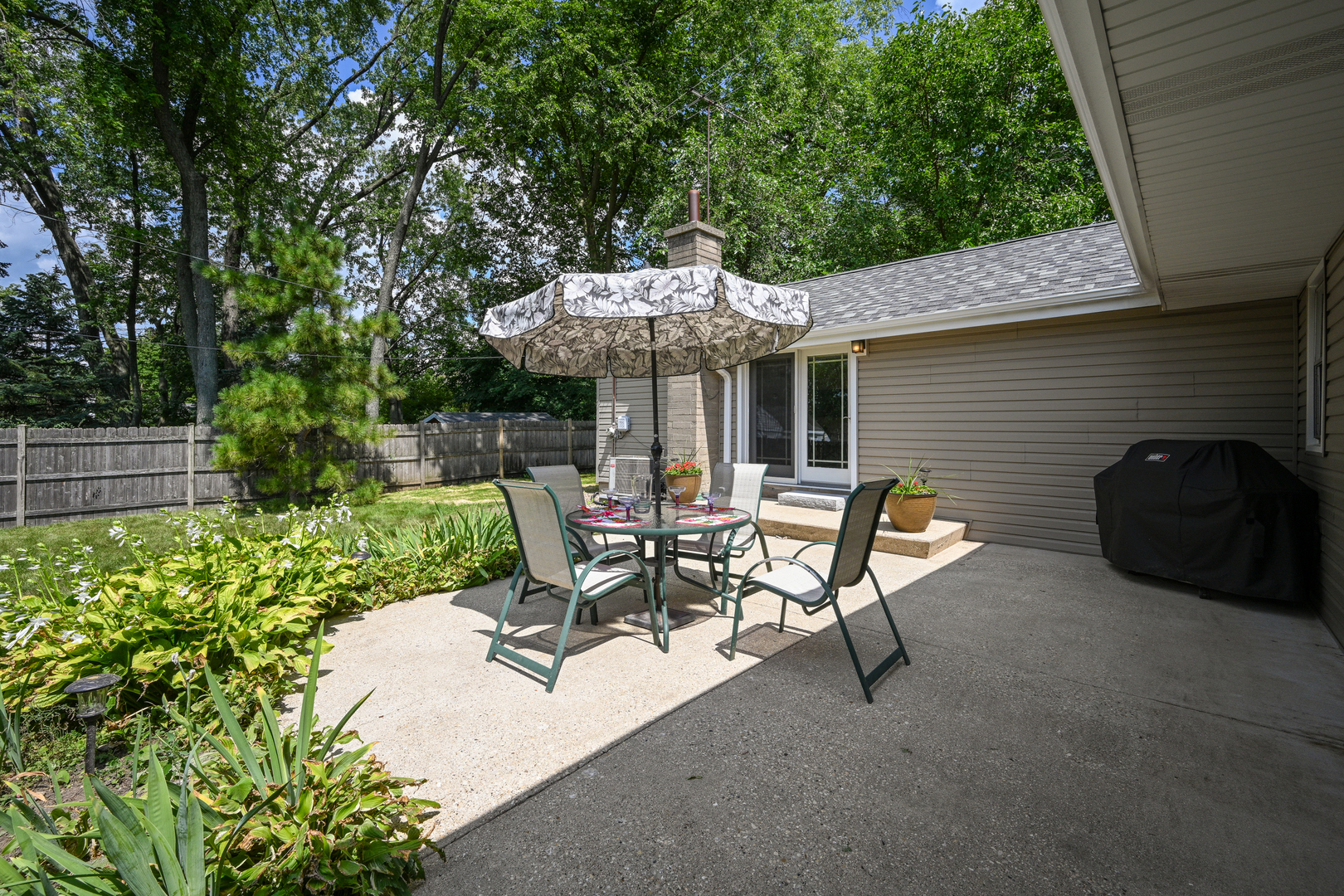 440 West Harrison Road Lombard, IL 60148 - Photo 23 of 26 a view of backyard with outdoor seating and plants