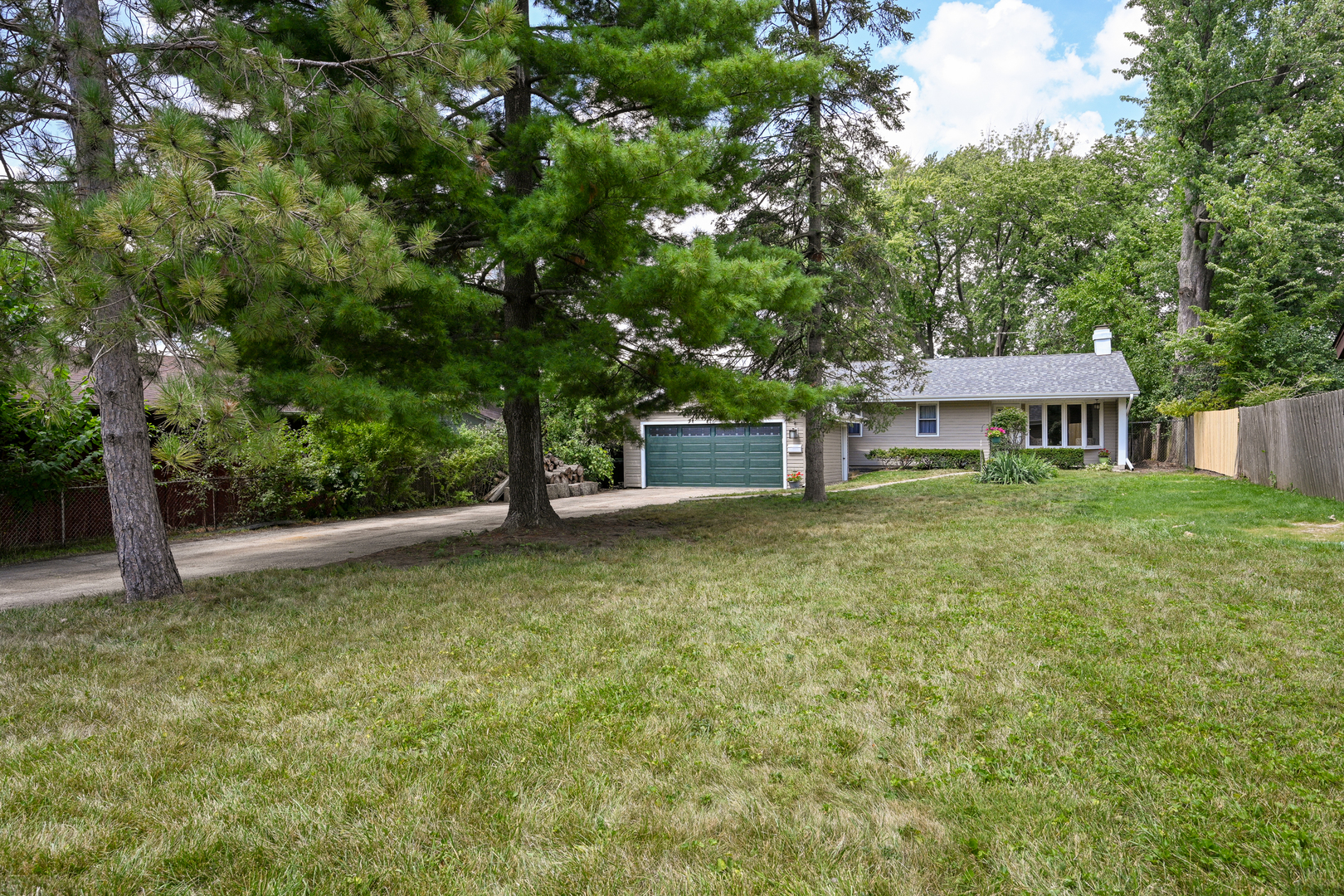 440 West Harrison Road Lombard, IL 60148 - Photo 3 of 26 a front view of a house with a yard
