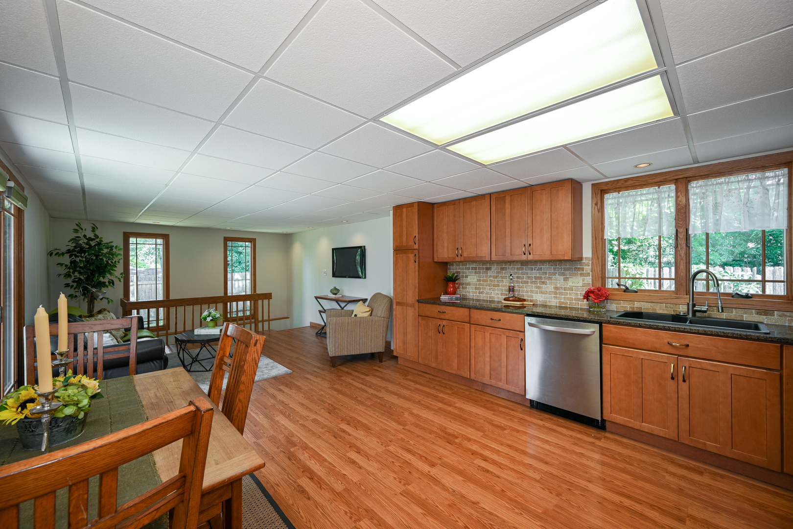440 West Harrison Road Lombard, IL 60148 - Photo 9 of 26 a large kitchen with lots of counter space and windows