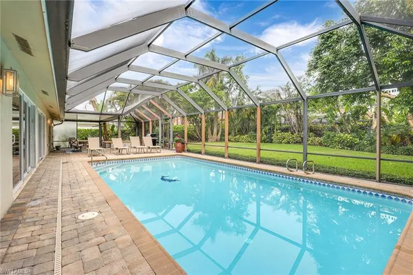 a view of swimming pool with a yard