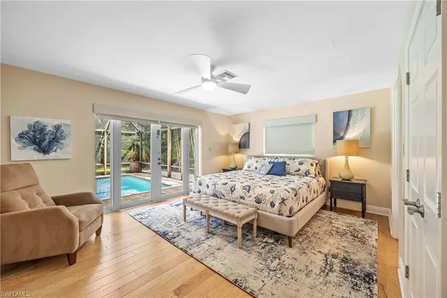 a bedroom with a bed a couch and dresser