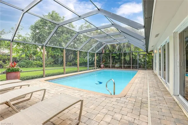 a view of swimming pool with seating space