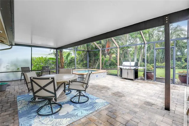 a view of a living room and patio area