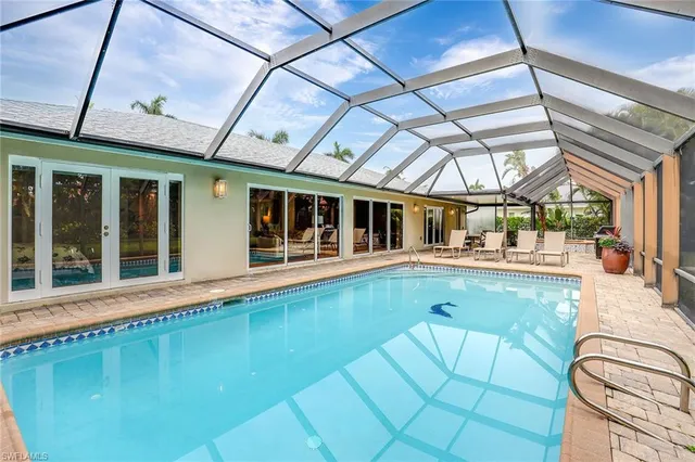 a view of a swimming pool with a patio