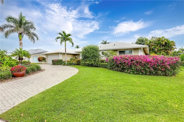 a view of a house with a garden