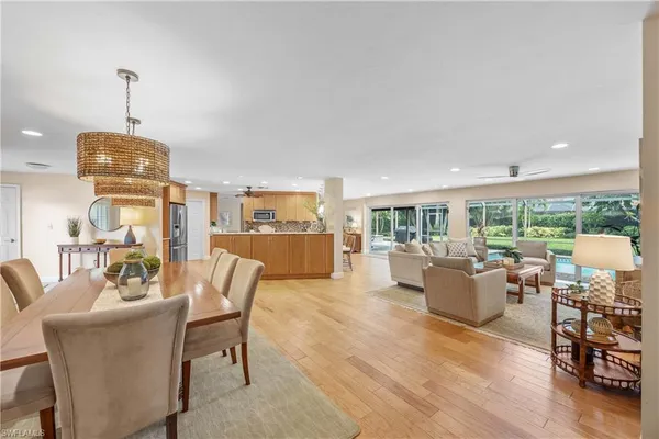 a view of a livingroom with furniture window and wooden floor