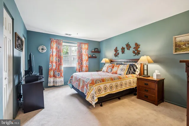 a bed room with a bed and a couch