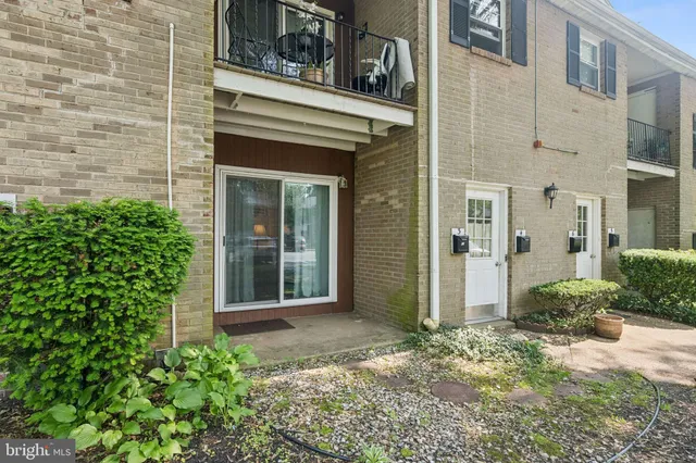front view of a brick house with a large windows